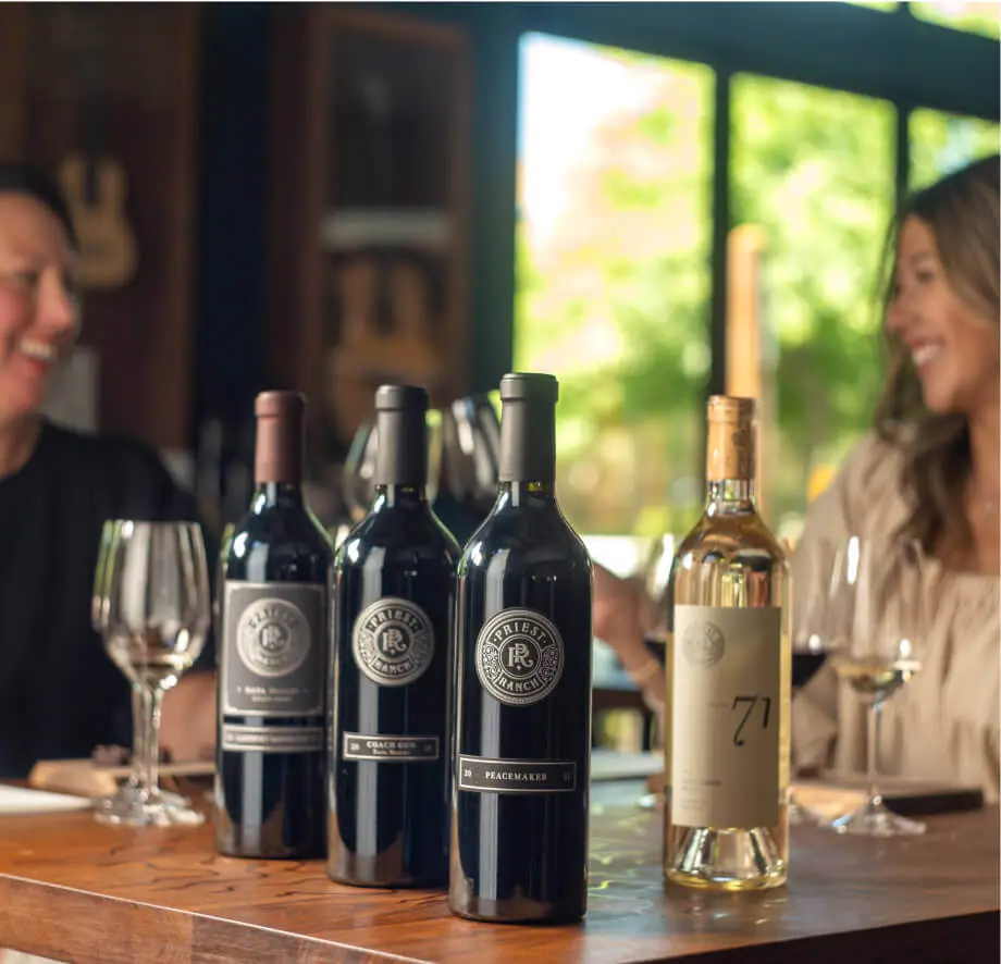 priest ranch bottles on table