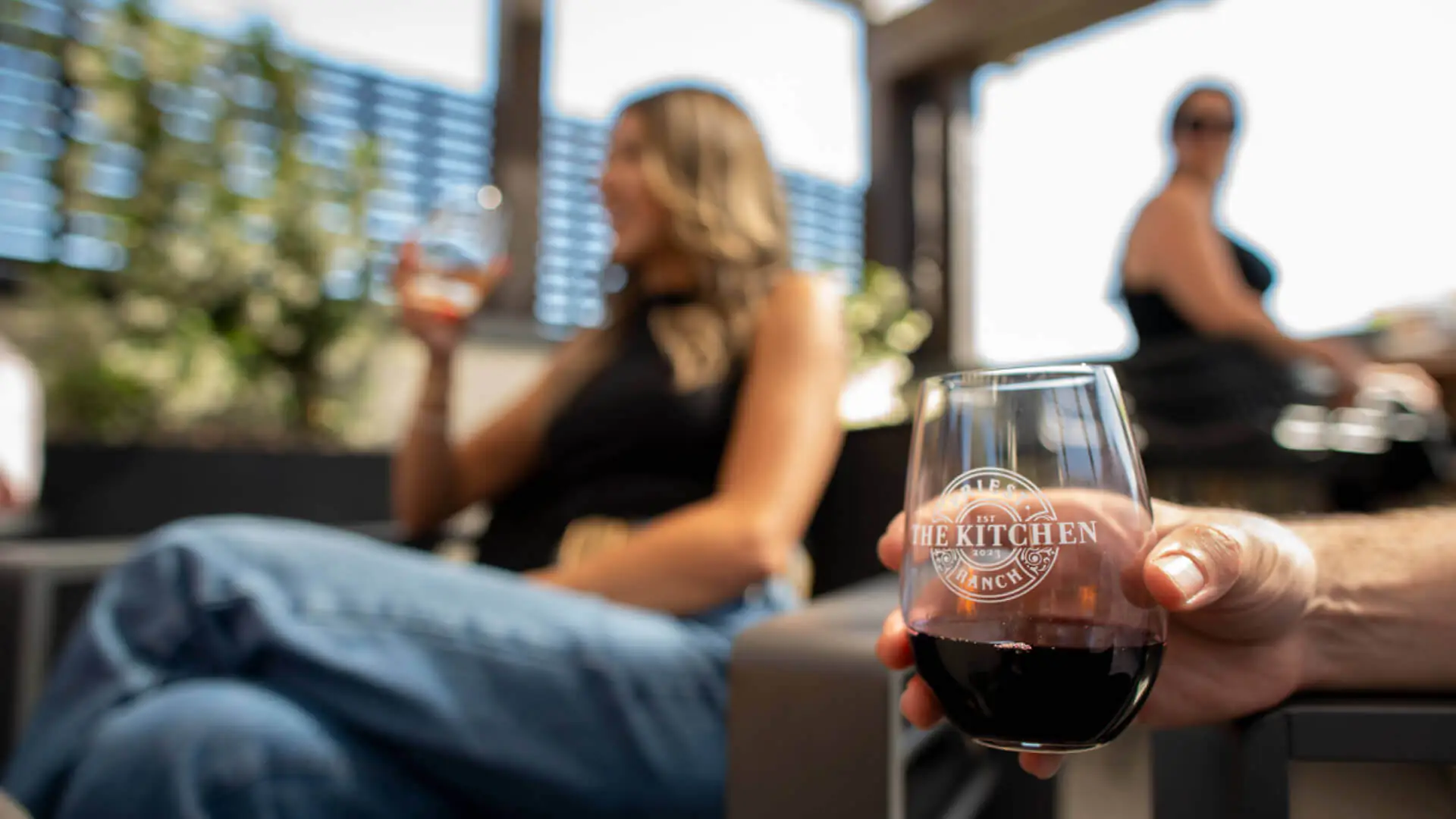 people sitting blurry image drinking wine