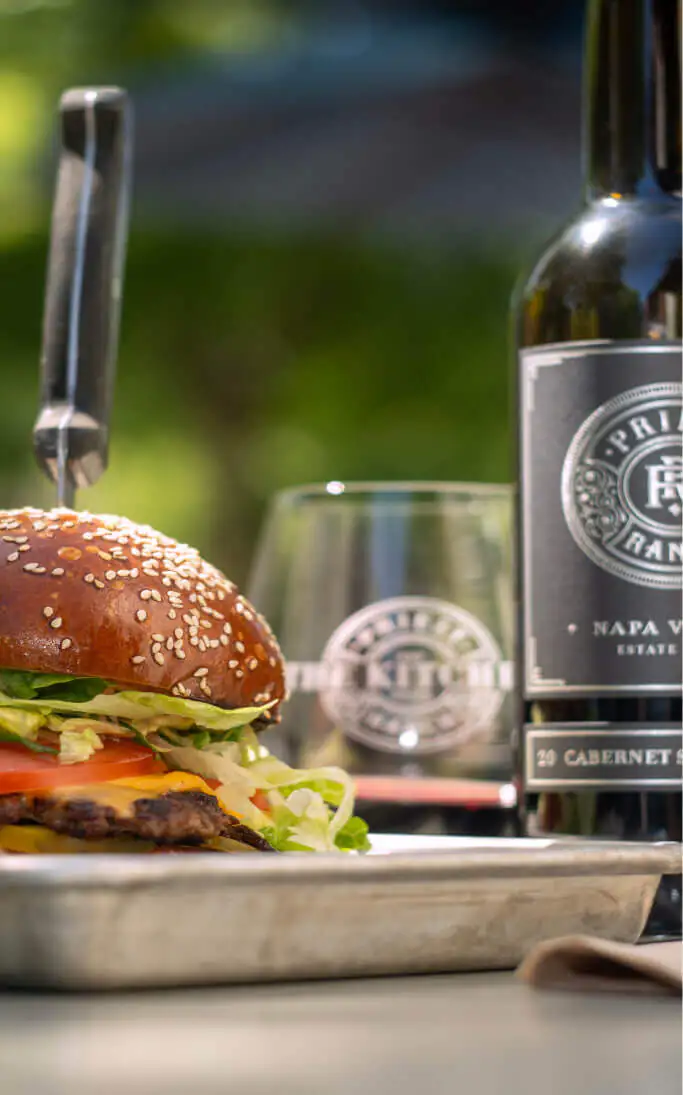 burger and glass of wine