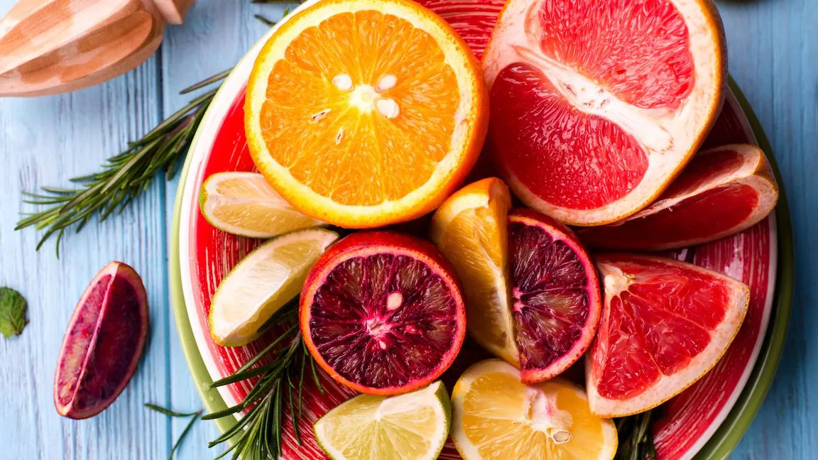 a bowl full of citrus fruits